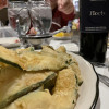 A plate of breaded zucchini and a bottle of red at Rico&#039;s Restaurant in Ross Township, Pa., Sept. 30, 2021 (Across North Hills photo/Matt De Reno)